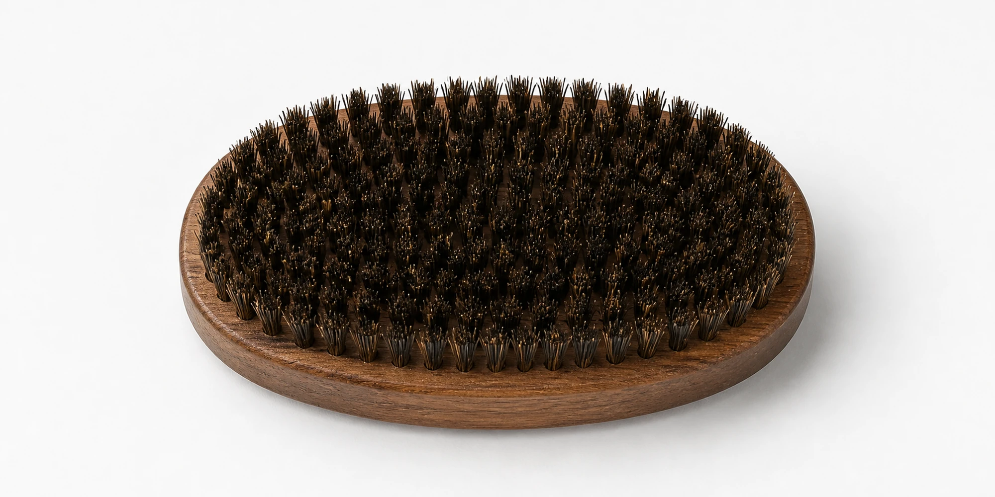 Boar bristle beard brush shown for beard oil distribution and underlying skin stimulation