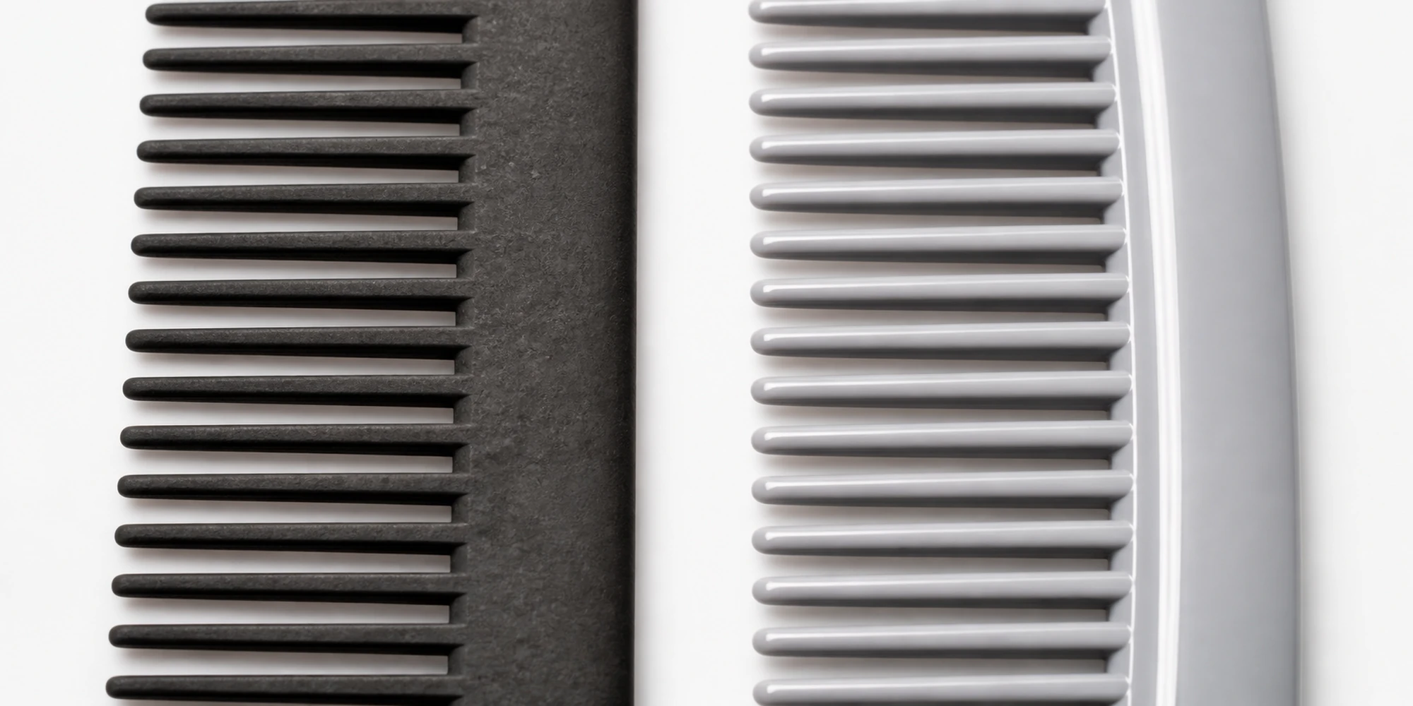 Close-up texture detail of carbon fiber composite material and standard ABS plastic comb surfaces