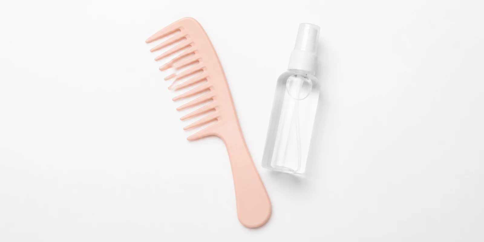 Wide-tooth comb and detangling spray shown for gently removing teased hair without breakage