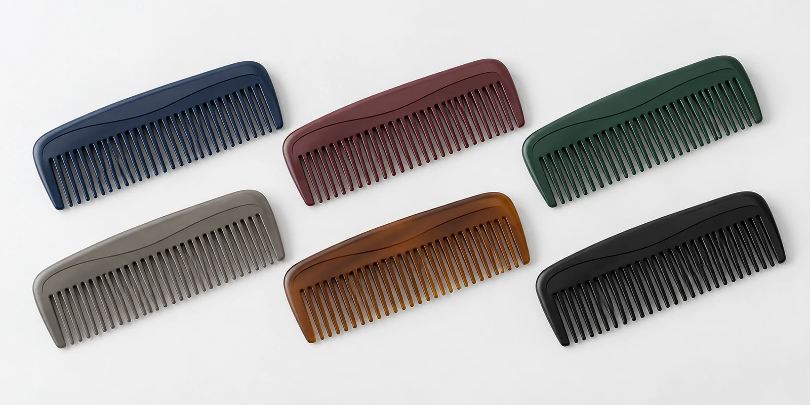 Multi-pack of colourful pocket combs arranged for checkout-adjacent impulse purchase retail display