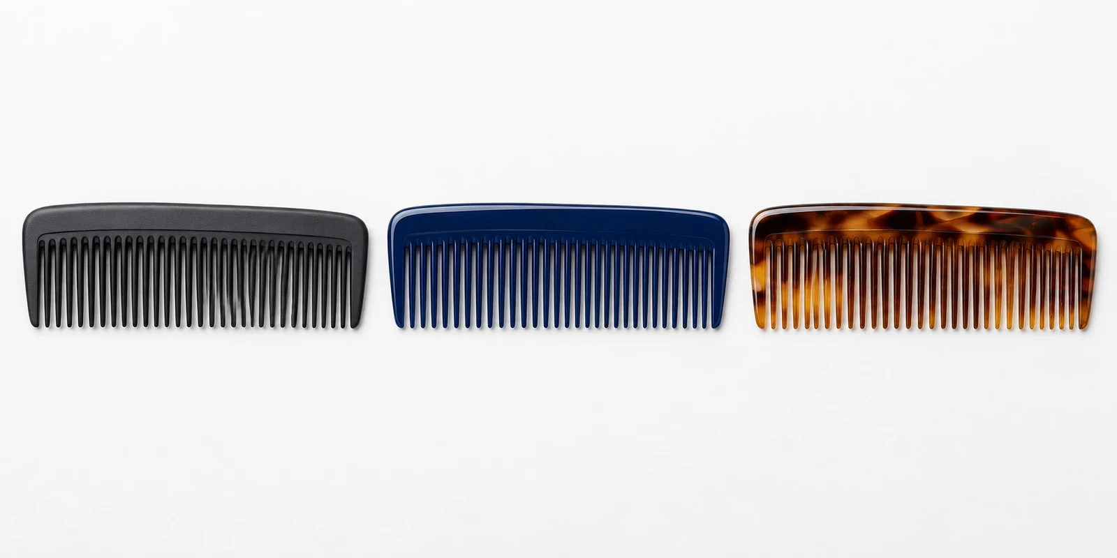 Tiered comb range showing standard moulded seamless finished and handmade sawcut acetate quality levels