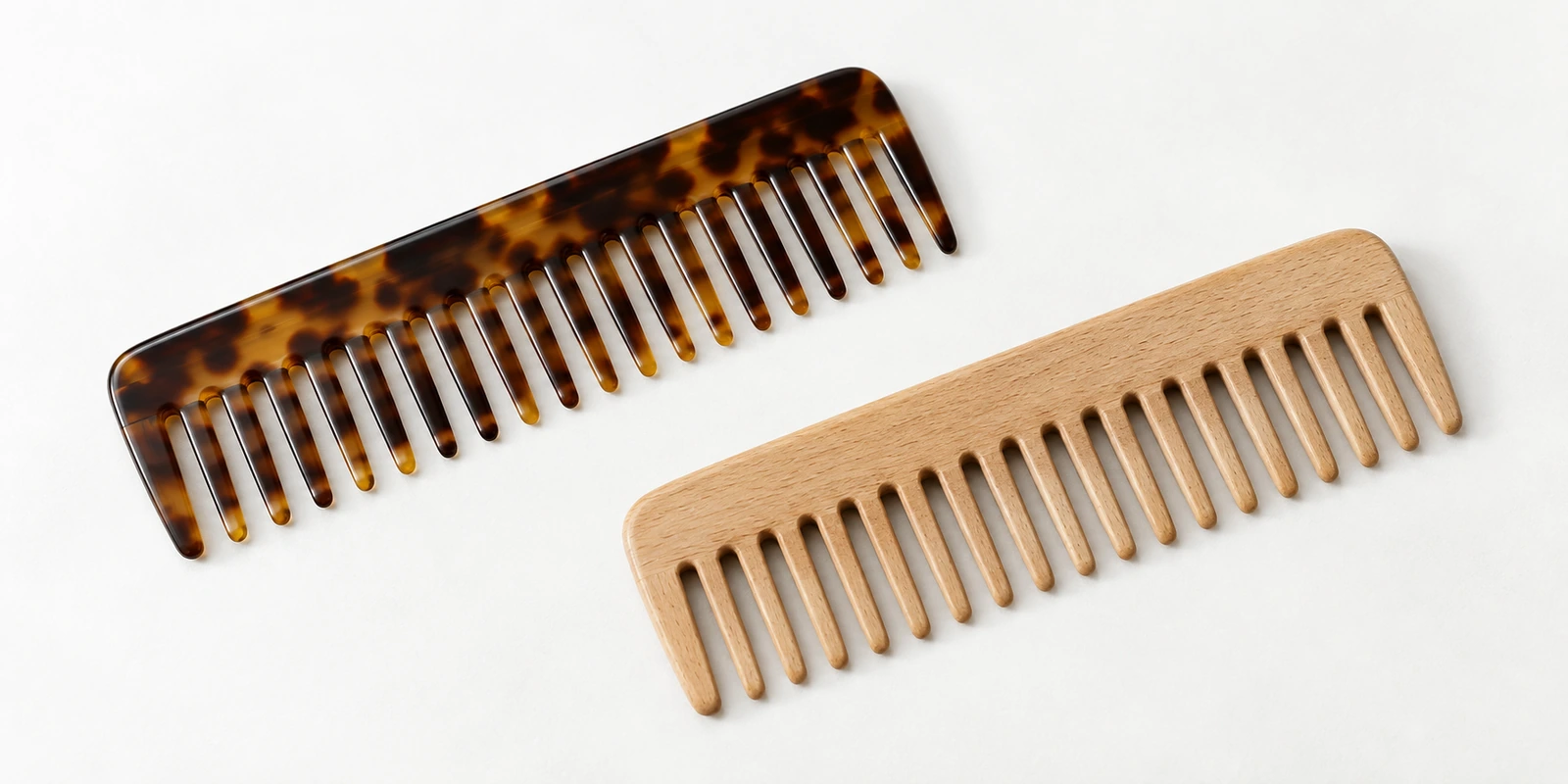 Wide-tooth comb and wooden comb shown for vinegar rinse distribution and material durability comparison