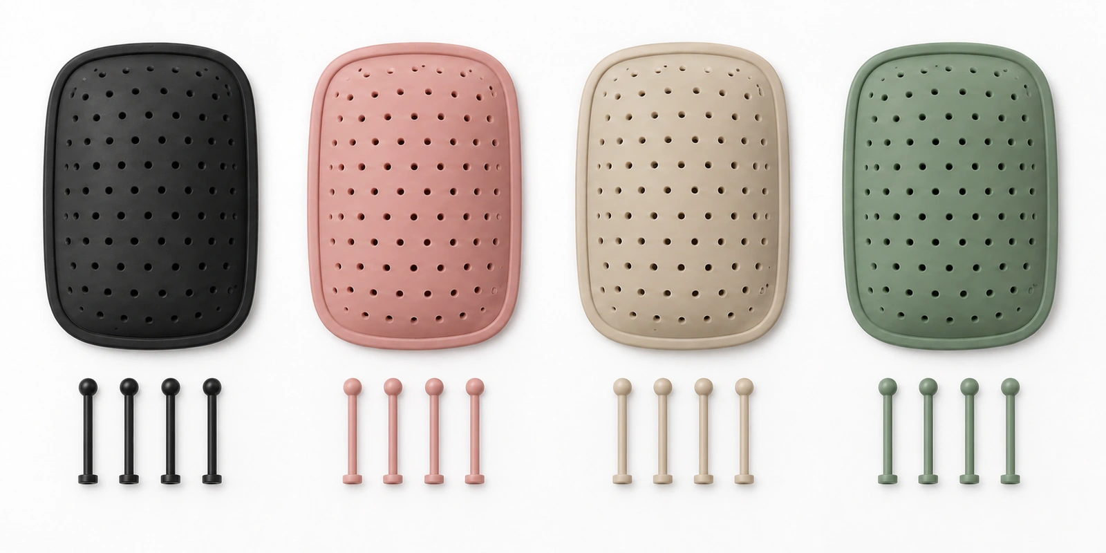 Hair brush cushion pads and nylon pins in different colors laid out as production swatches